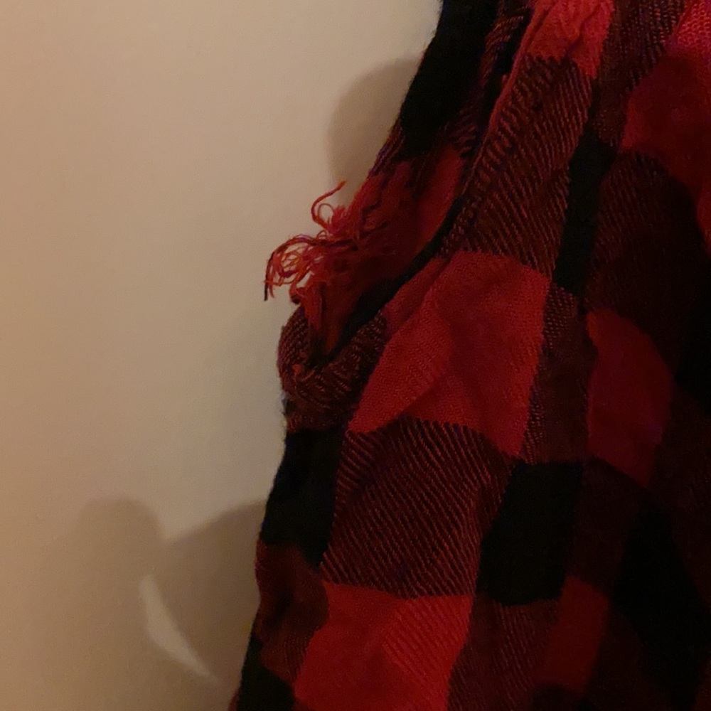 A red and black tank top with cross string over chest - Picture 2 of 7